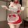 Sexy maid costume featuring a red and white outfit with a cup and saucer, perfect for festive occasions.