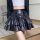 Glowing dark chic high-waisted ruffle leather skirt featuring tie waist and pleated design, perfect for a sexy a-line bodycon...