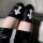 Glowing punk knee-high leg sleeves featuring shiny patent leather and bold cross details, perfect for anime cosplay thigh hig...