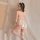 Woman in white lace bunny lingerie with open-crotch design, sheer stockings, and fluffy tail—seductive yet elegant.