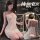 Woman in golden night sexy lingerie set with sheer strapless bra and matching briefs, holding wine glass, elegant design.