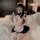 A woman poses on a bed wearing a semi-sheer maid costume from the gorgeous cloud lingerie set. the outfit features a cute des...