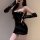 Sexy black leather dress with thong cut-out, bodycon fit, perfect for nightclub costumes.
