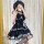 Gothic rock lolita strap dress featuring dark twin black and red plaid design with lace trimmings, perfect for edgy fashion e...