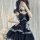 Gothic rock lolita strap dress featuring dark twin black and red plaid patterns with lace trimmings, perfect for edgy yet ele...