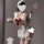 Woman in white ruffled lingerie set with red bow, holding a glass of milk. guan yun plus size lingerie set - pure & tempting ...