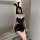 Sexy black pu leather lingerie set featuring a plunging top and mini skirt, perfect for adults seeking a bold and seductive l...