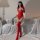 Sexy red bodysuit with open crotch and thigh-high stockings, featuring a zippered design and leather-like texture, perfect fo...