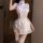A woman wearing a delicate guifeiqu lace sheer cheongsam lingerie set, featuring a sweet maid costume design with intricate l...