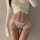 Sexy sheer lace bikini panties featuring hollow ring detail and thin straps, perfect for women seeking elegant design.