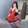 A woman poses in a red polka dot babydoll nightgown by guiyun, featuring scalloped trim and halter neck design, capturing a p...