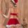 A woman wears a festive santa outfit featuring a red velvet top with white trim and matching skirt adorned with fluffy white ...