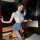 A woman poses elegantly in a vintage-inspired lingerie set, featuring a lace top and fitted skirt, perfect for a secretary-th...