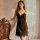 Elegant black lace-trimmed satin sleep dress with adjustable straps, perfect for pure sensuality and comfort.