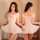 Woman modeling white ice silk lingerie set with revealing chest cutout and bodycon mini skirt, front and back view.
