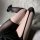 Sexy black fishnet stockings with thigh-high design, featuring sheer lace-up detail and bold pattern for an edgy look.