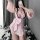 A woman poses in a pink floral japanese-style bunny kimono lingerie set, featuring a large bow and playful design, perfect fo...