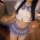Japanese-style outfit featuring a cute top with a bow tie and a pleated skirt, perfect for women looking for a playful and re...