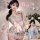 Japanese-style couples pajama set featuring matching kimonos, playful bedroom outfit with floral designs and bows.