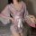 Woman wearing pink floral japanese-inspired lace kimono robe set, holding a fan, showcasing seductive plus size sleepwear and...