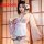 Woman wearing pink japanese kawaii bunny kimono robe with lace, bow, and floral print — sexy sleepwear lingerie set.