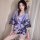 A woman wears a purple japanese kimono cosplay outfit, featuring floral patterns and a silky texture, perfect for roleplay an...