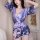 A woman models a purple japanese kimono cosplay outfit, featuring floral patterns and a bow tie, perfect for roleplay and pho...