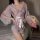 A woman models a new japanese kimono lingerie set featuring a pink yukata robe with floral patterns, accented by a bow detail...