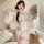A woman poses elegantly in a japanese kimono lingerie set, featuring sheer fabric and floral prints. the outfit includes a de...