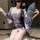 A woman poses wearing a japanese kimono-style lingerie set, featuring floral patterns and elegant design, perfect for role pl...