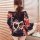 Back view of a woman wearing a black floral japanese kimono-style lingerie set with a large bow detail, perfect for photoshoo...
