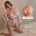 A woman poses wearing a delicate japanese kimono-style lingerie set, featuring floral patterns and a soft pink ribbon. the ou...