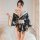 A woman models a japanese kimono-style lingerie set featuring a floral print, elegant design, and off-shoulder style, perfect...