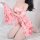 A woman poses wearing a pink floral japanese-style lace kimono, paired with fishnet stockings and a matching bralette set, id...