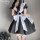 Japanese lolita maid costume set featuring a black lace bodice with white accents, paired with thigh-high stockings for a cla...