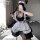 A woman poses in a japanese lolita maid costume set featuring a black lace bodice and thigh-high stockings, capturing a playf...