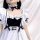 Japanese maid cosplay dress featuring black and white design with ruffles, bows, and corset detail, perfect for anime school ...