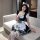 A woman poses wearing a japanese maid cosplay dress featuring a sweet cat girl design. the outfit includes a ruffled skirt, b...