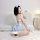 Japanese maid costume set featuring cute pastel blue lingerie with lace details, ties, and a detachable skirt.