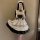 Japanese maid costume dress featuring a cute lolita style with ruffles and lace details, perfect for cosplay or daily wear.