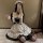 Japanese maid costume dress featuring a cute lolita style with ruffles and bows, perfect for cosplay or daily wear.
