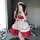 A person wearing a japanese maid costume, featuring a red and white lolita dress with ruffles and bows, perfect for cosplay o...