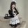 A woman wearing a japanese maid dress, featuring black and white colors with ruffles, holding a tray. perfect for cosplay or ...