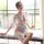 A woman poses elegantly in a japanese-style sleepwear set featuring sheer chiffon lace, with floral patterns on the kimono ro...