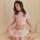 A woman models a japanese-style sexy nurse costume featuring a pink sailor uniform skirt set with a heart emblem, perfect for...