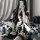 A woman poses in a japanese-style sleepwear set featuring a kimono-inspired nightgown and robe with a wrap design, adorned wi...