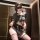 Woman in black jinxiao jk flirty lingerie skirt with pleated design and sheer stockings, elegant temptation underwear.