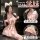 Model wearing pink jinxiao jk flirty lingerie skirt with pleated design, bow tie top, cat ears, and lace eye mask.