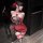 Woman wearing red jinxiao rose lace lingerie set with beads, ties, and garters — seductive pure-yu style erotic underwear.