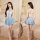 Woman modeling jk uniform lingerie set with blue plaid pleated skirt, white crop top, tie, and lace-top stockings.